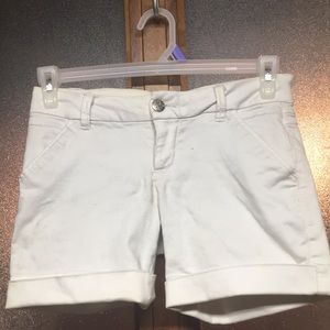 White GP Jean branded shorts.